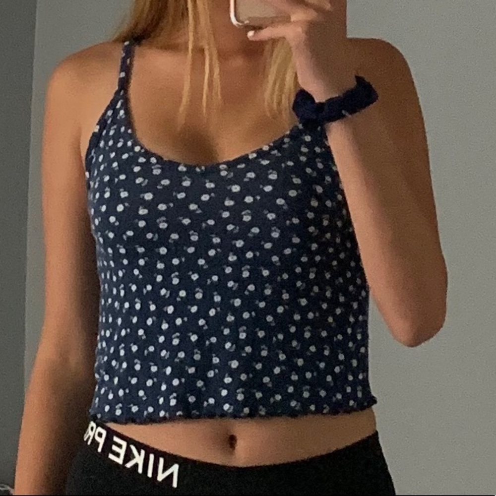 Navy blue tank top with a white floral print